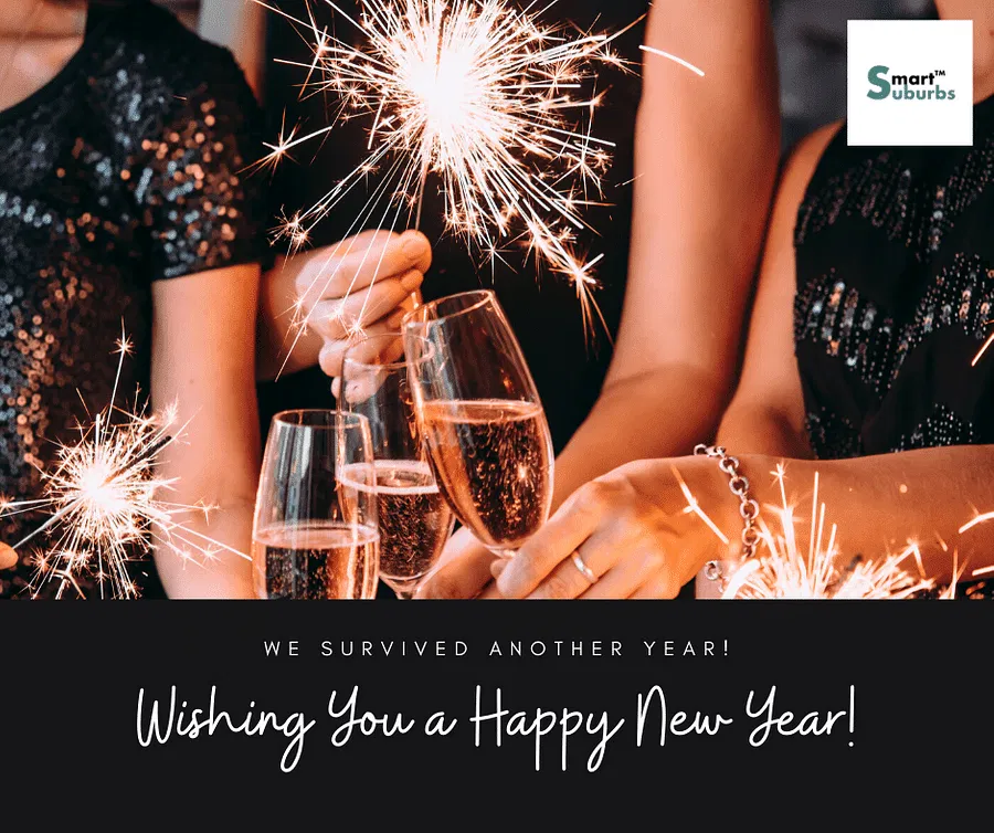 Three people celebrate with champagne and sparklers—Smart Suburbs, your Hyperlocal Digital Marketing Agency in Pune, wishes you a Happy New Year. - IPSense.com